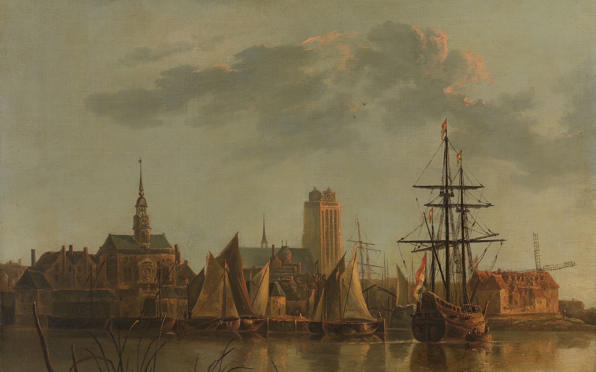 Gezicht op Dordrecht bij zonsondergang